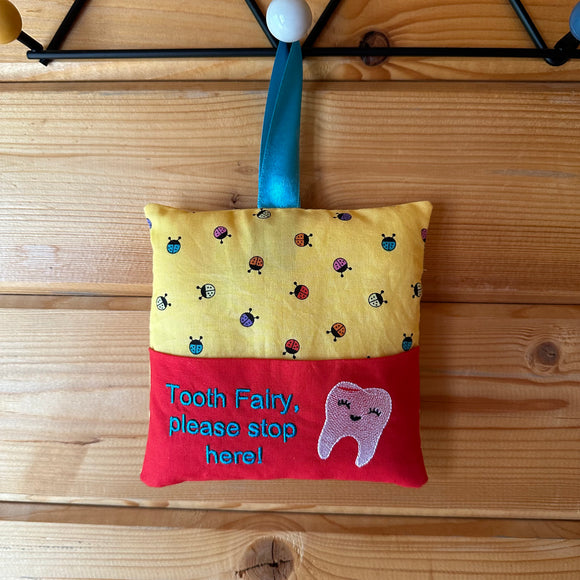 Tooth fairy cushion, ladybird print with teal text