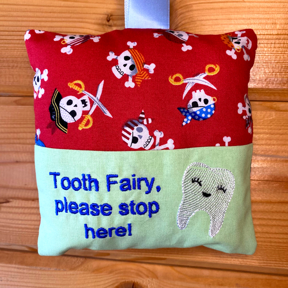 Tooth fairy cushion, skull and crossbone print