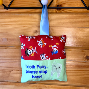 Tooth fairy cushion, skull and crossbone print