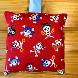 Tooth fairy cushion, skull and crossbone print